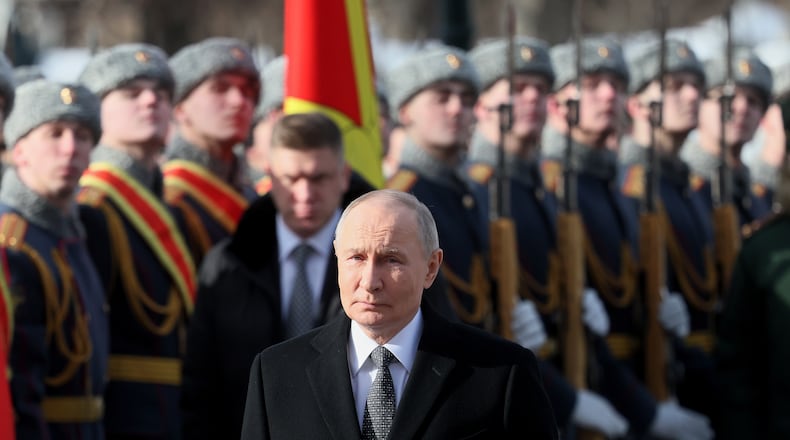 FILE - Russian President Vladimir Putin attends a wreath-laying ceremony at the Tomb of the Unknown Soldier near the Kremlin Wall during the national celebration of "Defender of the Fatherland Day" in Moscow, Russia, Feb. 23, 2026. (Maxim Shipenkov/Pool Photo via AP, File)