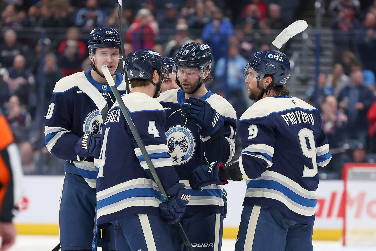 Columbus Blue Jackets center Adam Fantilli (19) celebrates his goal with center Cole Sillinger (4) and defenseman Ivan Provorov (9) during the second period of an NHL hockey game against the Washington Capitals, Saturday, April 12, 2025, in Columbus, Ohio. (AP Photo/Joe Maiorana)