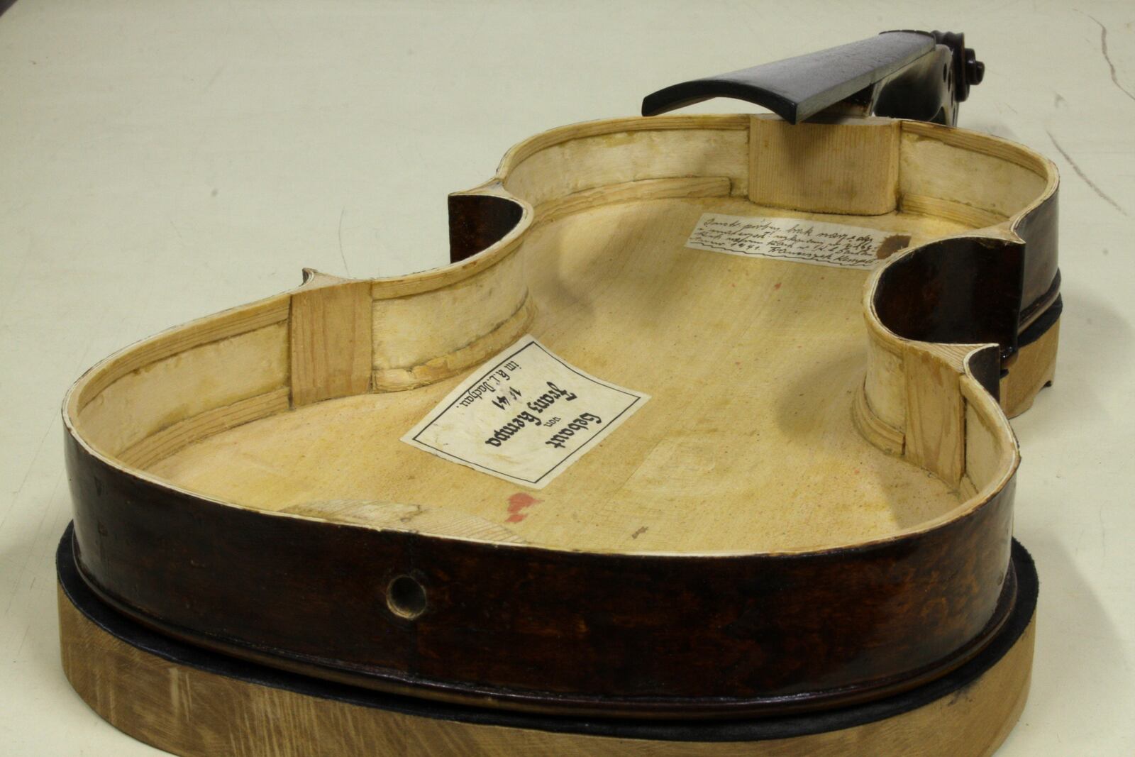 Tags from its maker are seen inside a Dachau-built instrument dubbed the ''violin of hope'', in Magyarpolány, Hungary, Tuesday September 8, 2020. (Szandra Katona via AP)