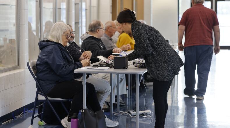 Poll workers check in residents to vote at Edgewood Middle School Tuesday, May 2, 2023. The only issue on the ballot at this location is a levy for Edgewood Schools. NICK GRAHAM/STAFF