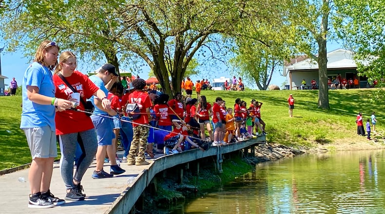 Hundreds of special needs students and volunteer high school students enjoyed a day of fishing and fun as part of a decades-old tradition in a local park. Sponsored by the Fairfield Optimist Club on its Joyce Park campus near the city border of Fairfield and Hamilton, the annual fishing day for special needs students is a spring highlight for Fairfield Schools and all the participants. (Photo By Michael D. Clark/Journal-News)