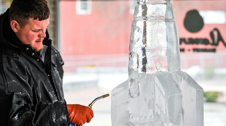 Jon Michael, lead carver with Artic Diamond Ice Sculptures, created a sculpture of a rocket during a media preview event for IceFest 2017 Friday, Jan. 13 at Startek in Hamilton. That year’s particular IceFest, held every other year by the nonprofit City of Sculpture, took place on Jan. 20 & 21, 2017 in downtown Hamilton. NICK GRAHAM/STAFF