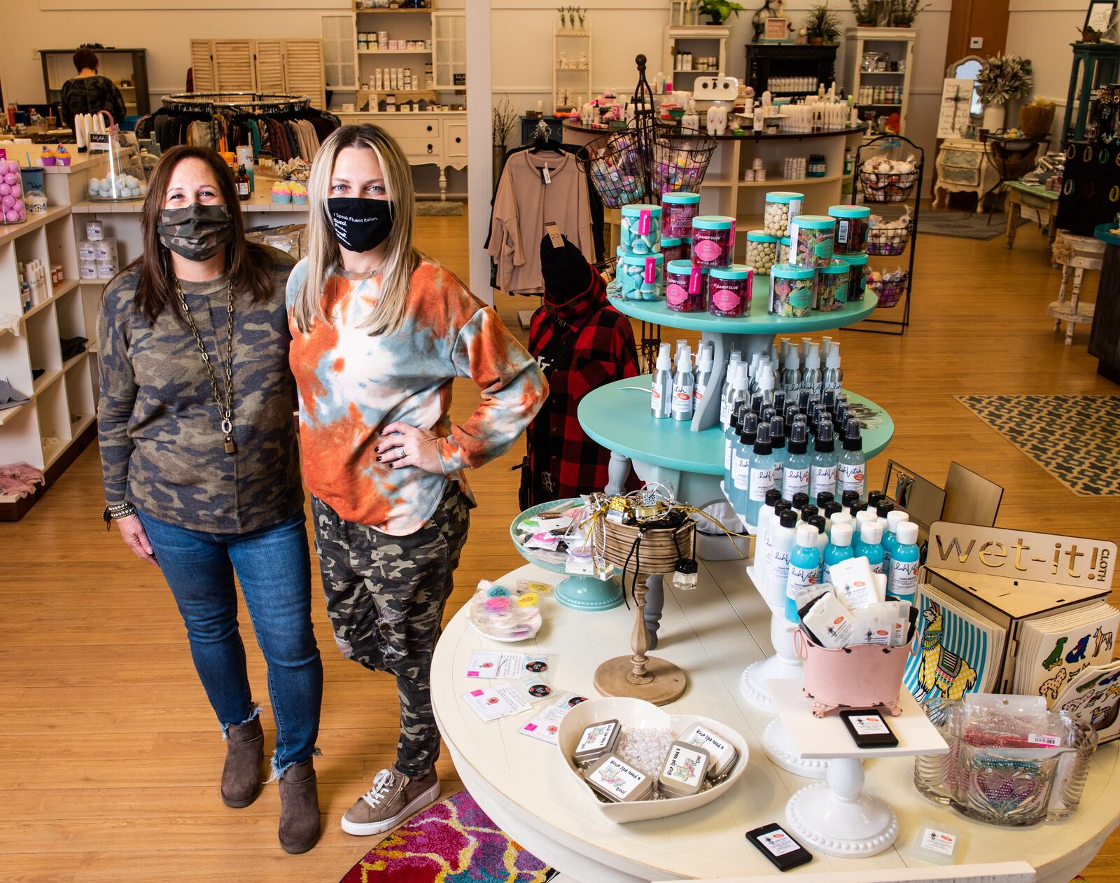 Lisa Macy, left, and Venita Allen stand in the new location of lahVdah at Bridgewater Falls. LahVdah recently moved from their location on Main Street in Hamilton. NICK GRAHAM /STAFF