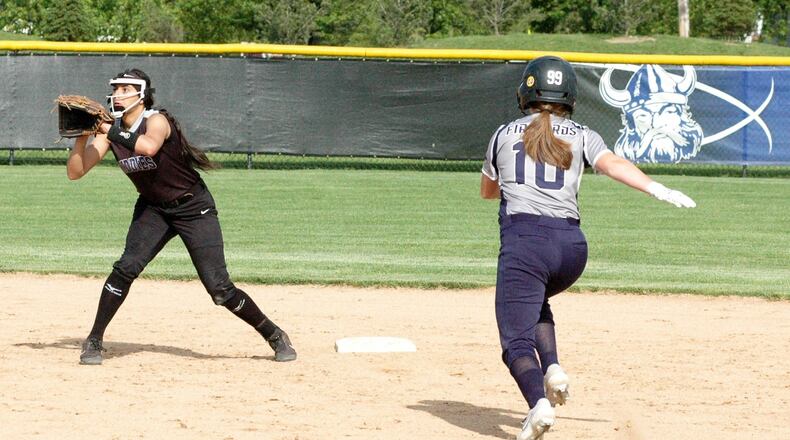 Middletown shortstop Arianna Layne is about to tag out Fairmont’s Taylor Hilty (10) on a steal attempt Tuesday during a Division I district softball semifinal at Miamisburg. Fairmont won 7-2. RICK CASSANO/STAFF