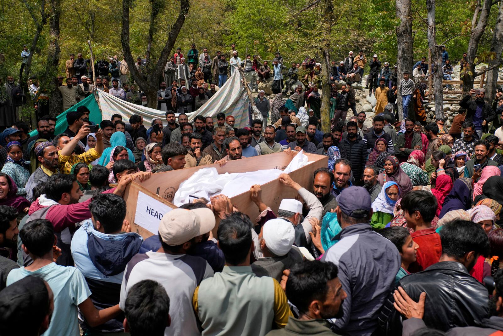 The body of Adil Hussain Shah, a daily-wage worker, who was killed when militants indiscriminately opened fire on a crowd of mainly tourists on Tuesday, is carried for burial at his village Hapatnar, about 20 km (13 miles) from Pahalgam where the incident took place, Indian controlled Kashmir, Wednesday, April 23, 2025. (AP Photo/Dar Yasin)