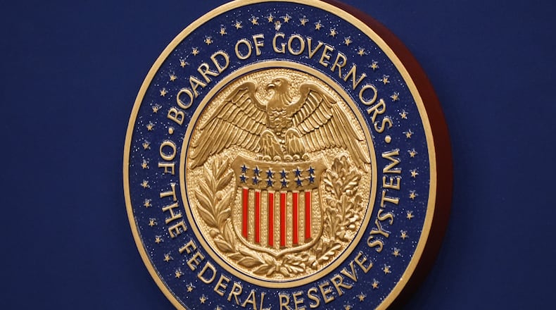 The Federal Reserve Chair logo appears on a podium at the Federal Reserve, Wednesday, Dec. 10, 2025, in Washington. (AP Photo/Jacquelyn Martin)