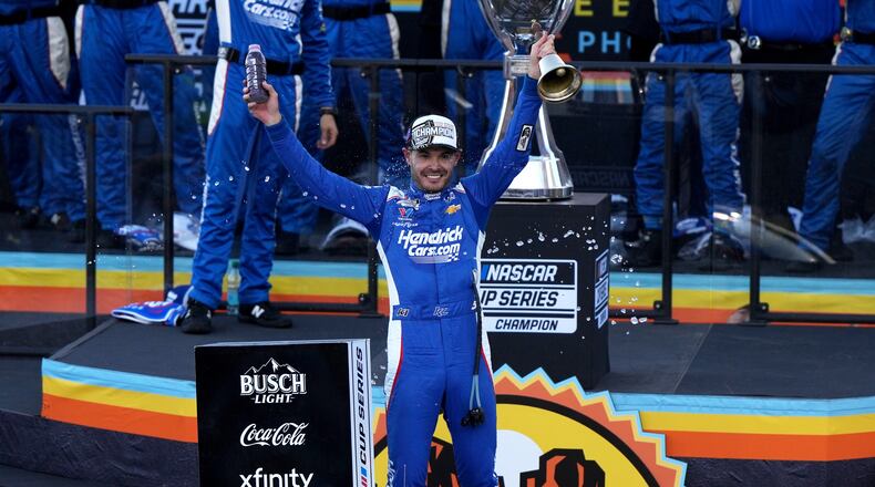 Kyle Larson celebrates after winning the NASCAR Cup Series championship Sunday, Nov. 2, 2025, in Avondale, Ariz. (AP Photo/Rick Scuteri)