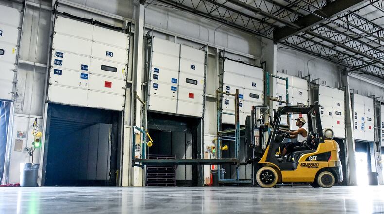 Bruce Alexander uses a forklift to load a trailer at Dedicated Logistics, Inc. Tuesday, Sept. 26 on Symmes Road in Hamilton. Dedicated Logistics, Inc. is offering positions for CDL A drivers seeking local home daily routes and has loading dock/warehouse positions available. NICK GRAHAM/STAFF