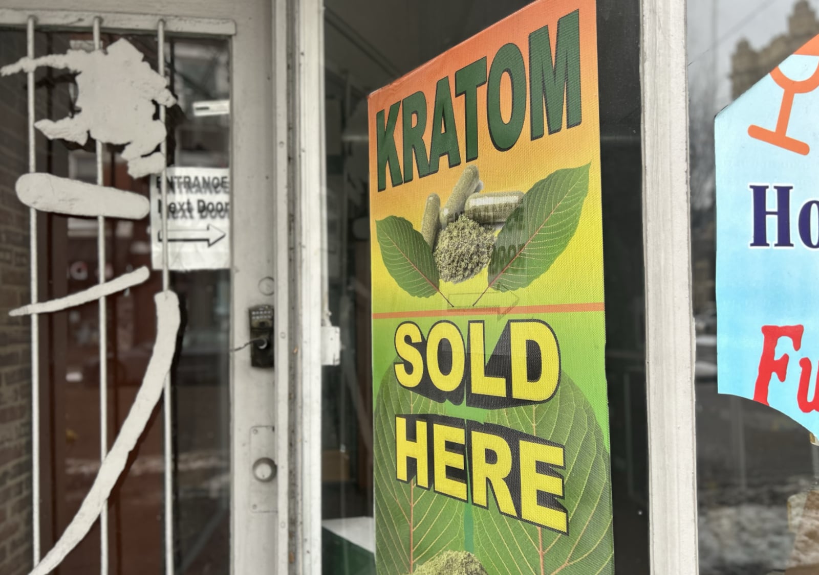 Kratom sold here sign on local smoke shop. WCPO