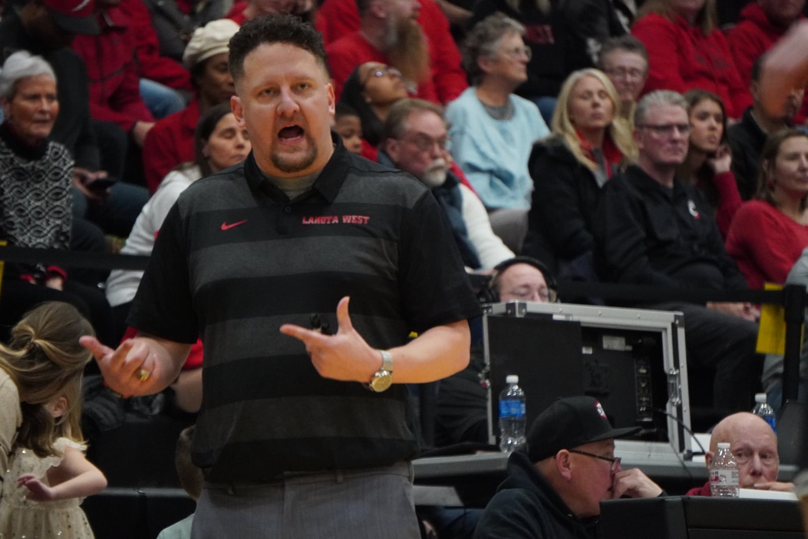 Lakota West coach Jay Chadwell communicates with his players during their game against Lakota East on Friday night. CHRIS VOGT / CONTRIBUTED