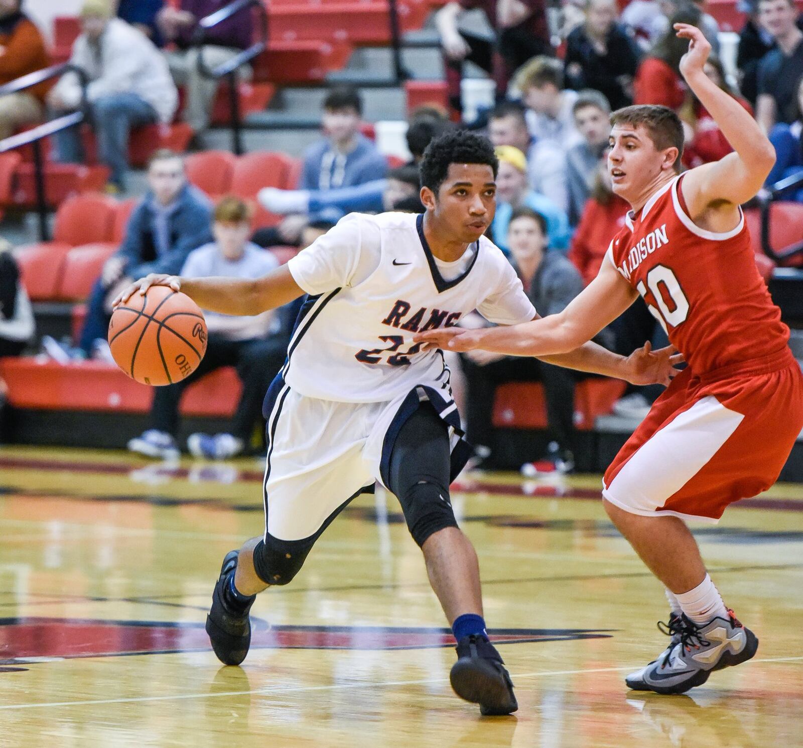 Miami Valley’s Marc Williams is on the move against Madison’s Tyler Baumgartner during Thursday night’s Brian Cook Classic at Madison. NICK GRAHAM/STAFF