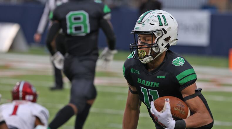 Badin's Braedyn Moore carries the ball on a punt return against Chardon in the Division III state championship game at Tom Benson Hall of Fame Stadium in Canton on Dec. 3, 2021. BILL LACKEY/STAFF
