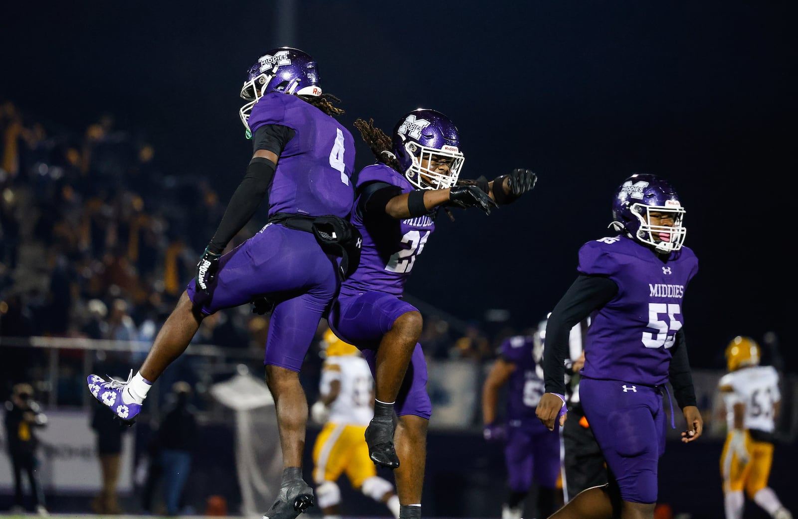 Middletown's Jordan Vann (4) celebrates his interception with teammate Wyman Carr during a 14-0 victory over Springfield in their Division I, regional semifinal playoff football game Friday, Nov. 14, 2025 at Barnitz Stadium in Middletown. NICK GRAHAM/STAFF