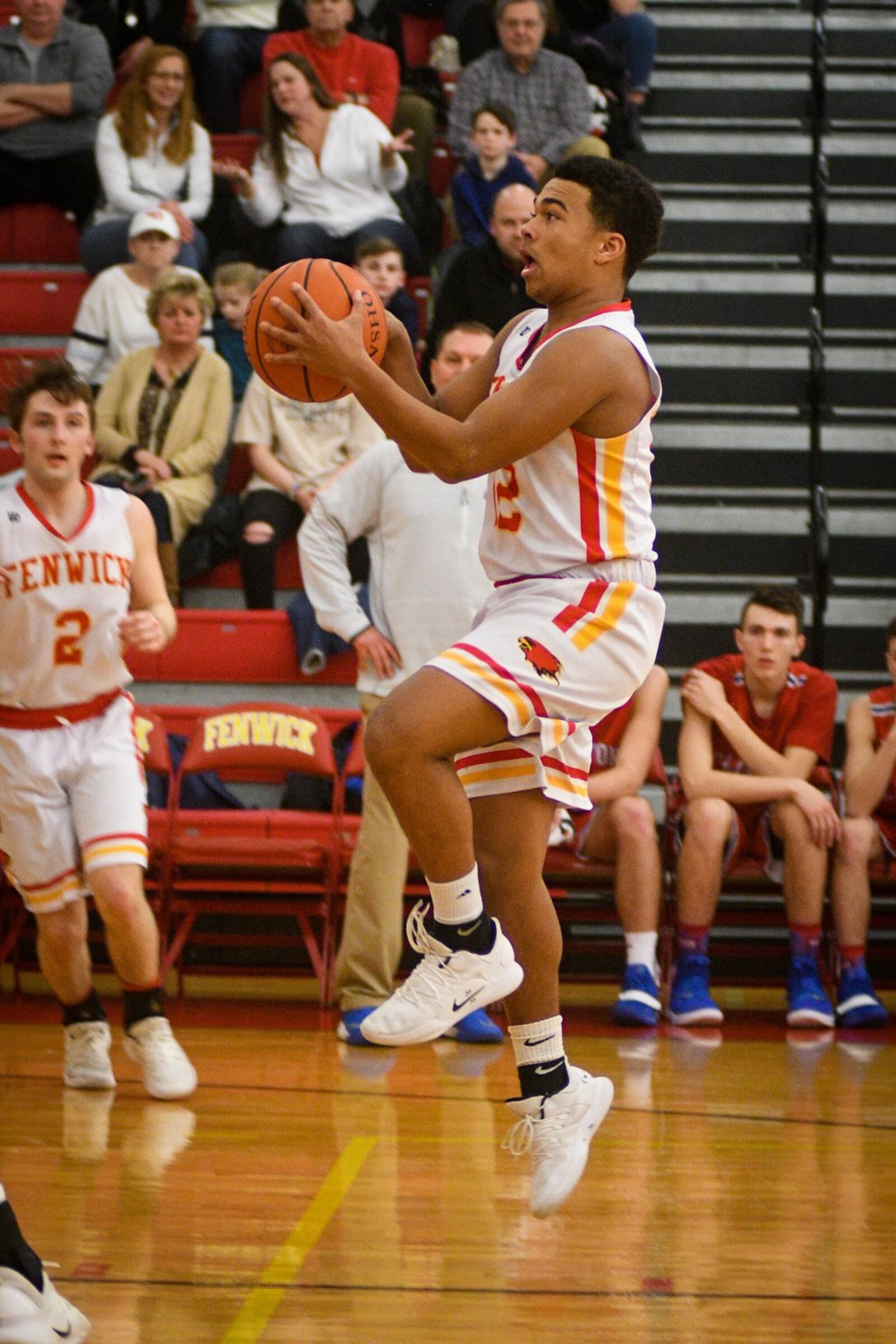 Fenwick’s Jordan Rucker elevates as he heads toward the basket during Monday night’s game against Clinton-Massie at Fenwick. The host Falcons won 67-48. ROB MCCULLEY/RAM PHOTOGRAPHY