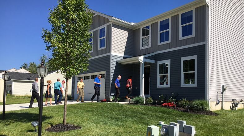 Members of Middletown City Council, the Planning Commission along with city officials toured a five-bedroom home in Amelia July 25 that was developed by Ryan Homes. The home builder is interested in building new homes in the $150,000 to $200,000 in the Sawyer Mill area of Middletown. ED RICHTER/STAFF