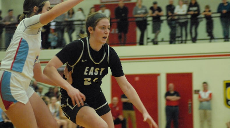 Lakota East senior Madison French drives past a Kings defender during a Division I regional semifinal contest on Wednesday night at Lakota West. The Thunderhawks fell 49-47. Chris Vogt/CONTRIBUTED