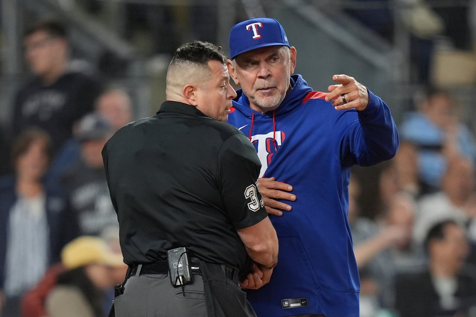 Texas Rangers manager Bruce Bochy exchanges words with home plate umpire Carlos Torres during the sixth inning of a baseball game against the New York Yankees Tuesday, May 20, 2025, in New York. (AP Photo/Frank Franklin II)