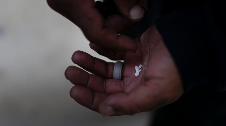 A drug user holds pieces of fentanyl. Use of the powerful synthetic opioid that is cheap to produce and is often sold as is or laced in other drugs, exploded in the past few years. Fentanyl is 50 times more potent than heroin, and even a small dose can be fatal. AP FILE