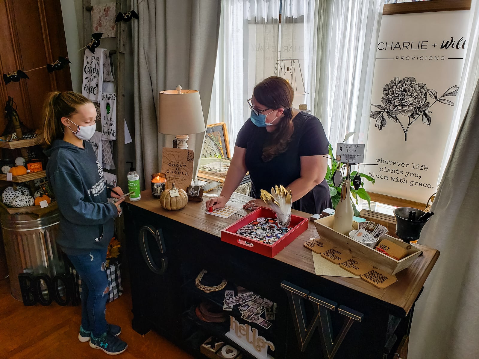 Kara Goheen, right, helps customer, Claire Mayhon, 12, at the recently opened Charlie + Will Provisions at 68 S. Main Street in Middletown Thursday, October 22, 2020. The shop has a variety of gift items, home decor and more. Goheen died on Sunday, Nov. 8, 2020. NICK GRAHAM / STAFF