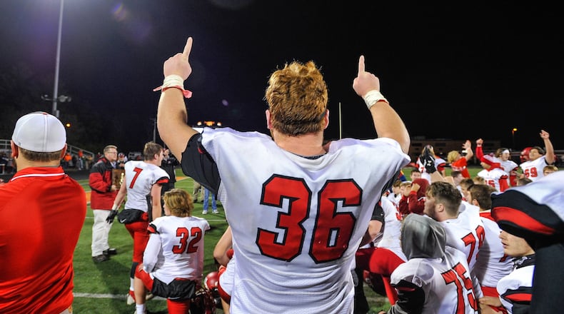 Madison’s Cole Pelgen (36) expresses himself after last Friday’s 42-7 triumph over West Jefferson in the Division V, Region 20 title game at Beavercreek. NICK GRAHAM/STAFF