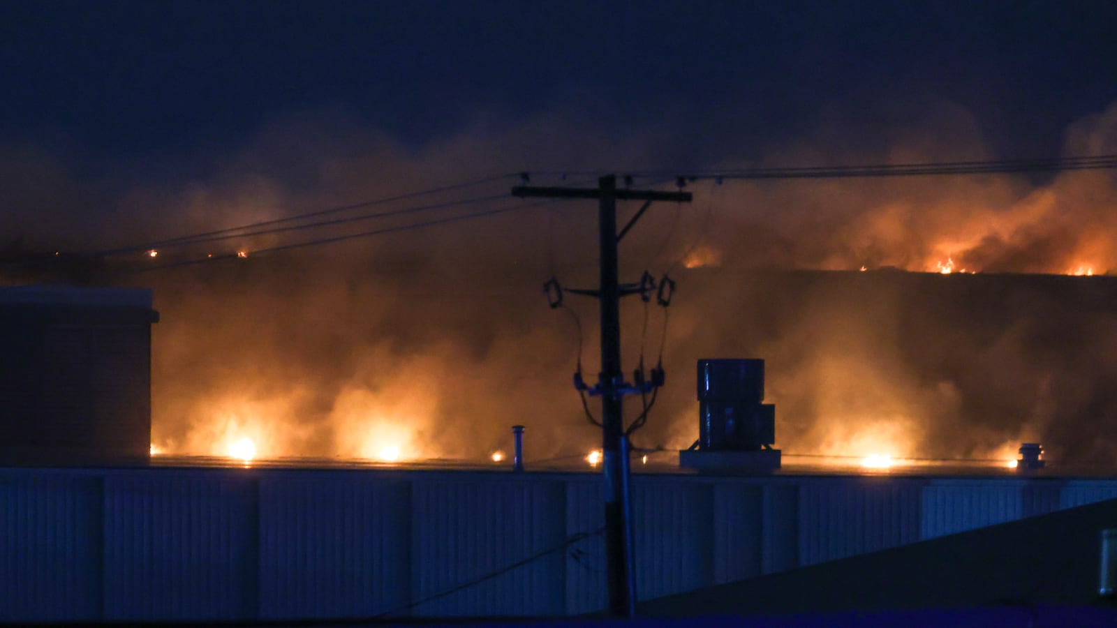 Area firefighters worked to pour water on flames at the Fuyao Glass America plant fire Sunday, March 22, 2026 in Moraine. Bryant Billing / Staff