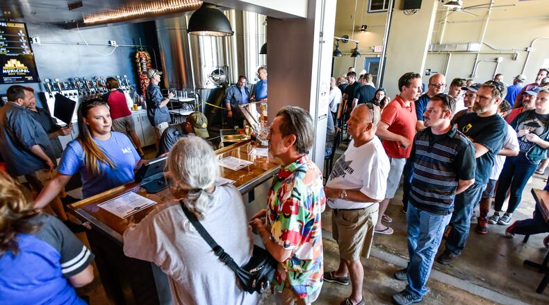 Municipal Brew Works on the back side of the old Municipal building at 20 High Street held their grand opening Wednesday, June 8, 2016 in Hamilton. NICK GRAHAM/STAFF