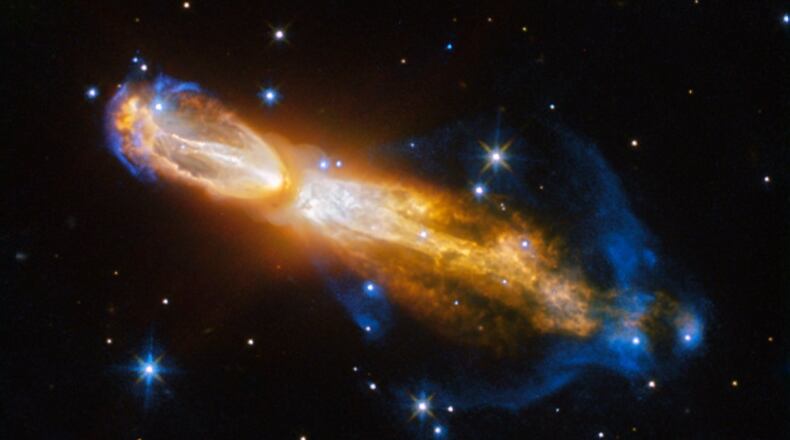 The Calabash Nebula, pictured here- which has the technical name OH 231.8+04.2 - is a spectacular example of the death of a low-mass star like the Sun. This image taken by the NASA/ESA Hubble Space Telescope shows the star going through a rapid transformation from a red giant to a planetary nebula, during which it blows its outer layers of gas and dust out into the surrounding space. The recently ejected material is spat out in opposite directions with immense speed , the gas shown in yellow is moving close to a million kilometres an hour. Astronomers rarely capture a star in this phase of its evolution because it occurs within the blink of an eye in astronomical terms. Over the next thousand years the nebula is expected to evolve into a fully fledged planetary nebula. The nebula is also known as the Rotten Egg Nebula because it contains a lot of sulphur, an element that, when combined with other elements, smells like a rotten egg but luckily, it resides over 5000 light-years away in the constellation of Puppis (The Poop deck).