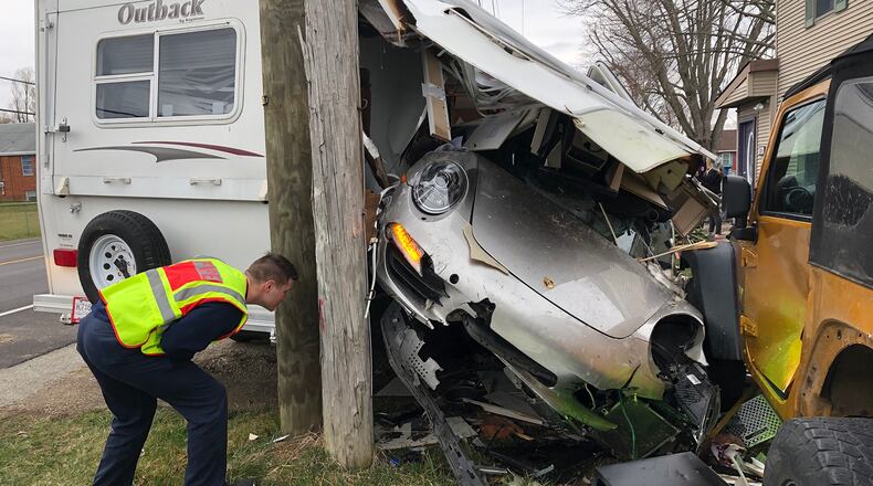 The driver of a Porsche drove off the left side of the road in the three thousand block of Springfield-Xenia Road and struck two mailboxes, a fence, two cars and a camper parked in front of a house Monday afternoon. The driver was not injured in the crash that left the Porsche inside the camper.