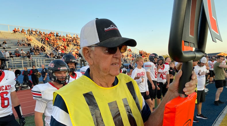 Tom Leeds graduated from the former Lemon-Monroe High School in 1959. Just two years later, he started working home football games as part of the sideline "chain gang," and hasn't stopped. Leeds is now 84 years old and the Monroe school board member has 64 years of volunteer work under his belt. He says working as an official downs marker is "the best seat in the house." Michael D. Clark / Contributed
