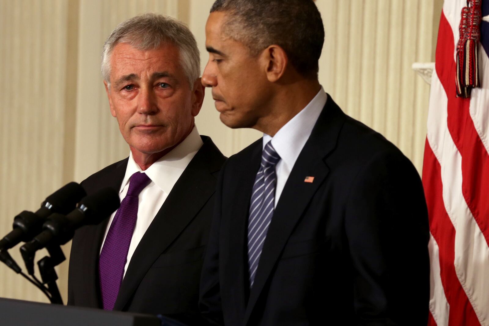 WASHINGTON, DC - NOVEMBER 24: U.S. President Barack Obama (R) speaks as Secretary of Defense Chuck Hagel looks on during a press conference announcing Hagel's resignation in the State Dining Room of the White House November 24, 2014 in Washington, DC. Sources say Hagel plans to remain in office until his successor is confirmed by the Senate. (Photo by Alex Wong/Getty Images) President Barack Obama (R) speaks as Secretary of Defense Chuck Hagel looks on during a press conference announcing Hagel's resignation in the State Dining Room of the White House November 24, 2014 in Washington, DC. Sources say Hagel plans to remain in office until his successor is confirmed by the Senate. (Photo by Alex Wong/Getty Images)
