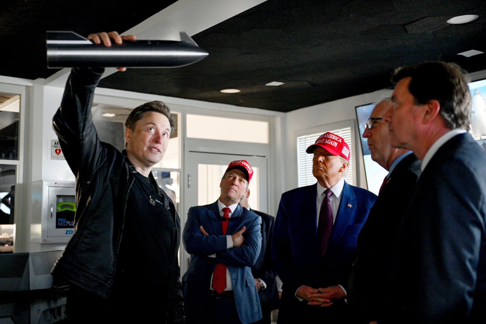 FILE - President-elect Donald Trump listens as Elon Musk explains the operations ahead of the launch of the sixth test flight of the SpaceX Starship rocket, Nov. 19, 2024, in Boca Chica, Texas. (Brandon Bell/Pool via AP, File)