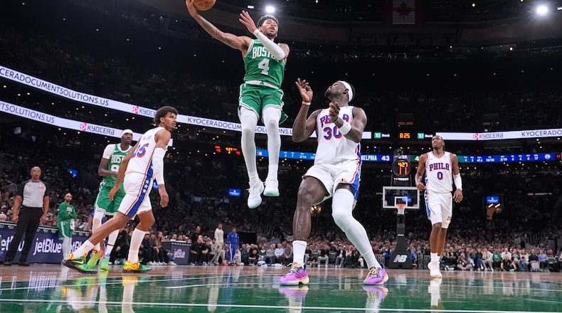 Boston Celtics guard Anfernee Simons (4) drives to the basket against the Philadelphia 76ers during the first half of an NBA basketball game, Wednesday, Oct. 22, 2025, in Boston. (AP Photo/Charles Krupa)