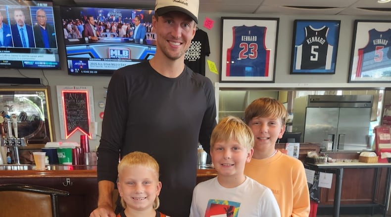 Luke Kennard, a Franklin High School graduate who has played eight seasons in. the NBA, poses with three brothers, from left, Walter, Stanley and George Dobrozsi at A&G Pizza in Franklin. SUBMITTED PHOTO