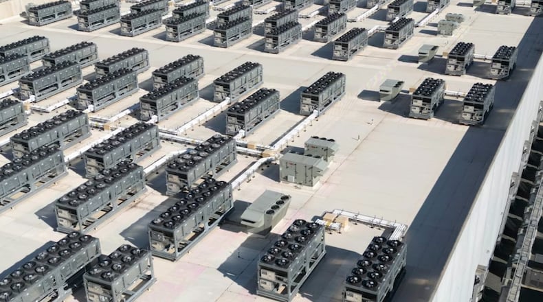 An aerial view shows cooling vent fans on the roof next to generators on the lower level of a data center in Ashburn, Va. Andrew Caballero-Reynolds/AFP via Getty Images