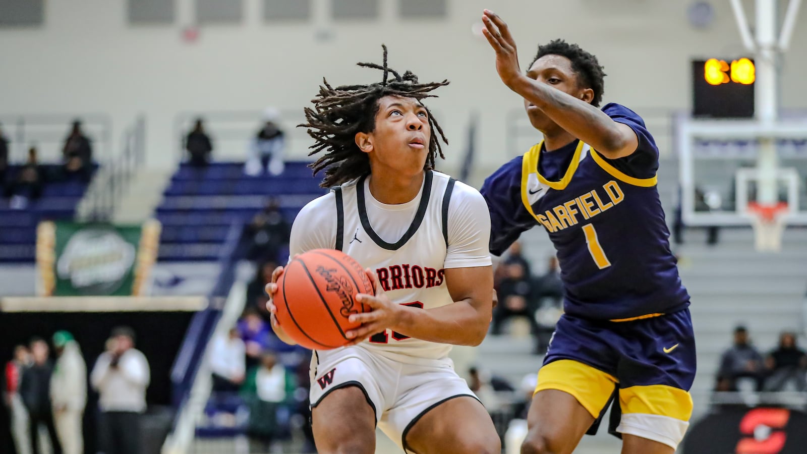 Wayne High School senior Jay'Sean Price is guarded by Garfield Heights senior Devaughn Jackson during their game earlier this year at The Beacon Orthopaedics Flyin' to the Hoop Invitational at Kettering's Trent Arena. MICHAEL COOPER/CONTRIBUTED