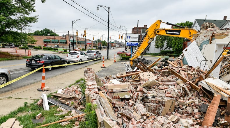 The need for construction workers is high on the jobs list. The former Wolpert insurance agency is among buildings demolished this summer to make way for soon-to-come improvements to the crossroads of Main Street with Eaton and Millville Avenues. NICK GRAHAM/STAFF
