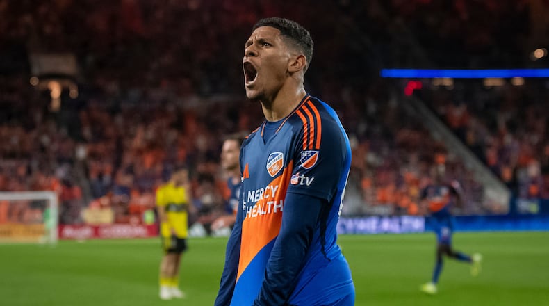 FC Cincinnati forward Ender Echenique celebrates after forward Kévin Denkey scored during the second half of Game 1 in the first round of MLS soccer's Eastern Conference playoffs against the Columbus Crew, Monday, Oct. 27, 2025, in Cincinnati. (AP Photo/Tanner Pearson)