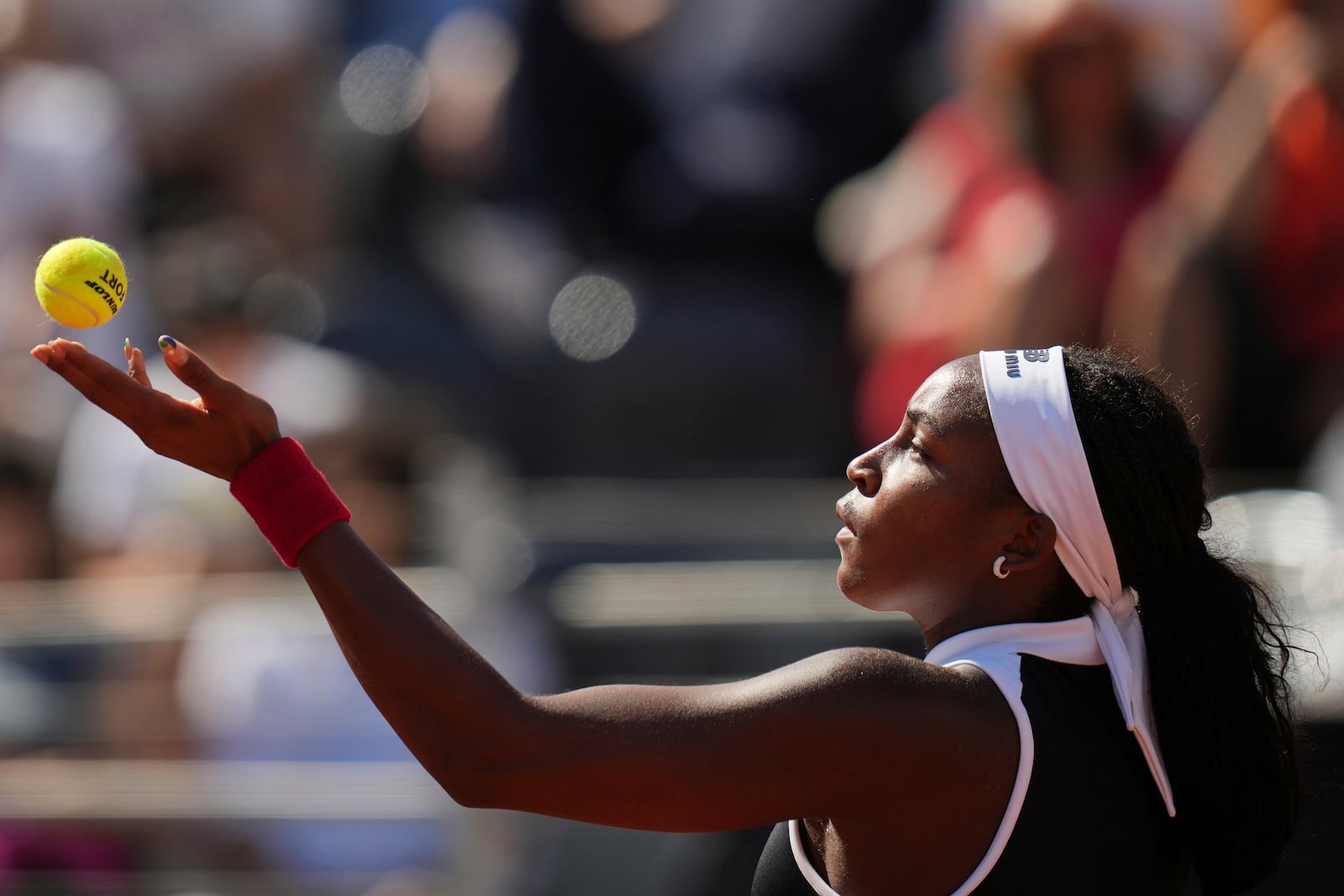 United States' Coco Gauff serves a ball to Britain's Emma Raducanu during their tennis match at the Italian Open at the Foro Italico, in Rome, Monday, May 12, 2025. (AP Photo/Alessandra Tarantino)