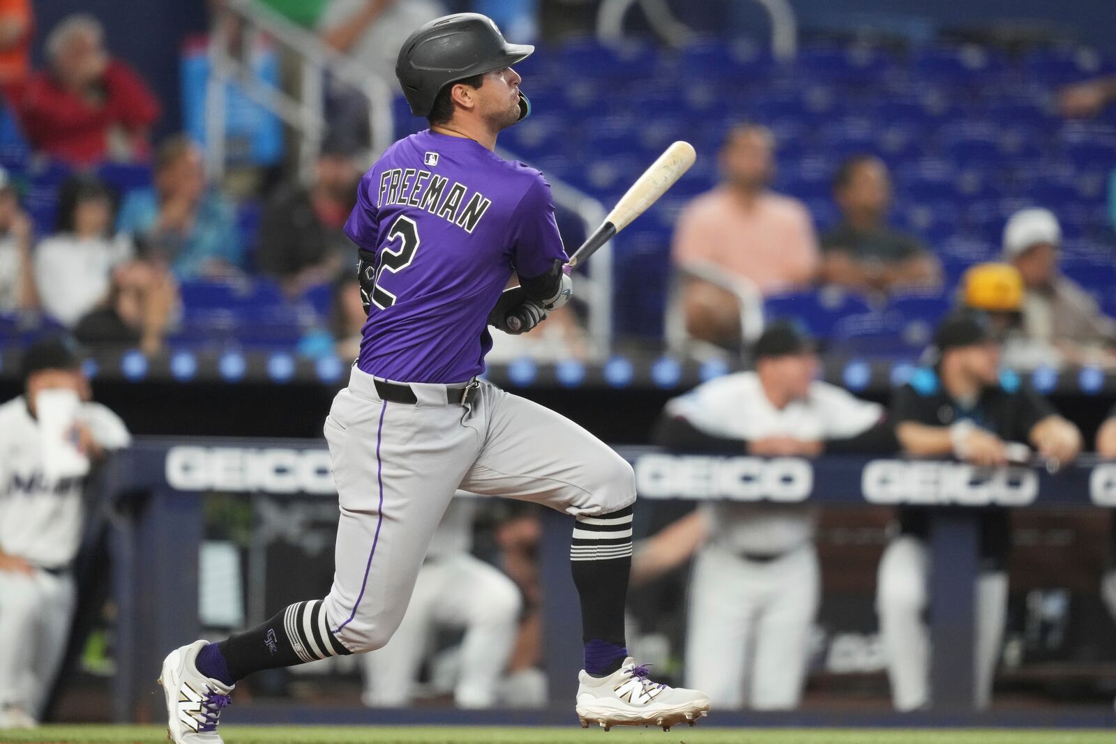 Colorado Rockies' Tyler Freeman (2) watches after hitting a double during the fifth inning of a baseball game against the Miami Marlins, Wednesday, June 4, 2025, in Miami. (AP Photo/Lynne Sladky)
