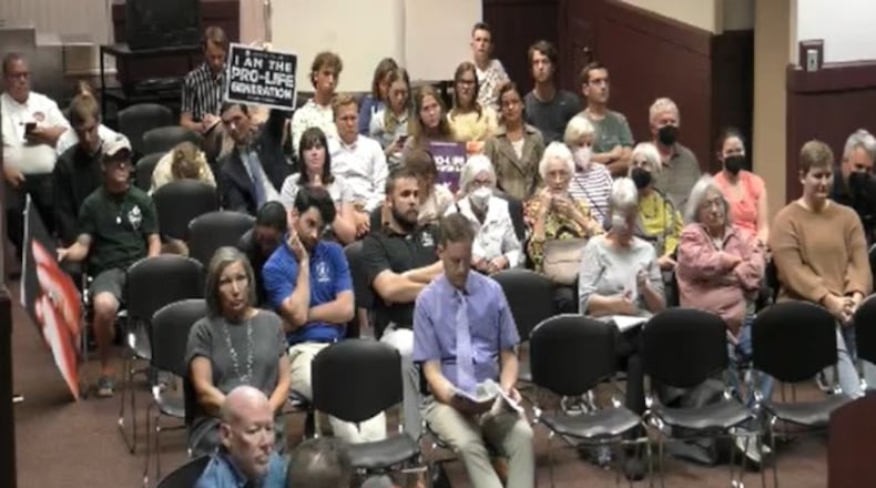 An Oxford court house crowd on Sept. 20 watches and reacts to the unanimous decision supporting the resolution. CONTRIBUTED