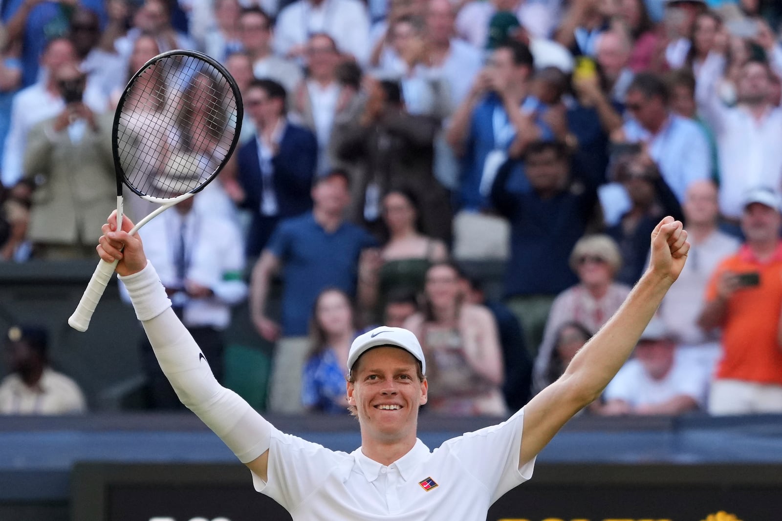 Jannik Sinner of Italy celebrates after winning the men's singles final match against Carlos Alcaraz of Spain at the Wimbledon Tennis Championships in London, Sunday, July 13, 2025.(AP Photo/Kirsty Wigglesworth)