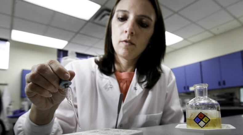 Brooke Ehlers, technical leader of the Miami Valley Regional Crime Laboratory’s Chemistry Section, tests a drug sample for fentanyl. The highly potent synthetic opioid — often cut with heroin or used alone — has been on the streets around Dayton since at least 2015.