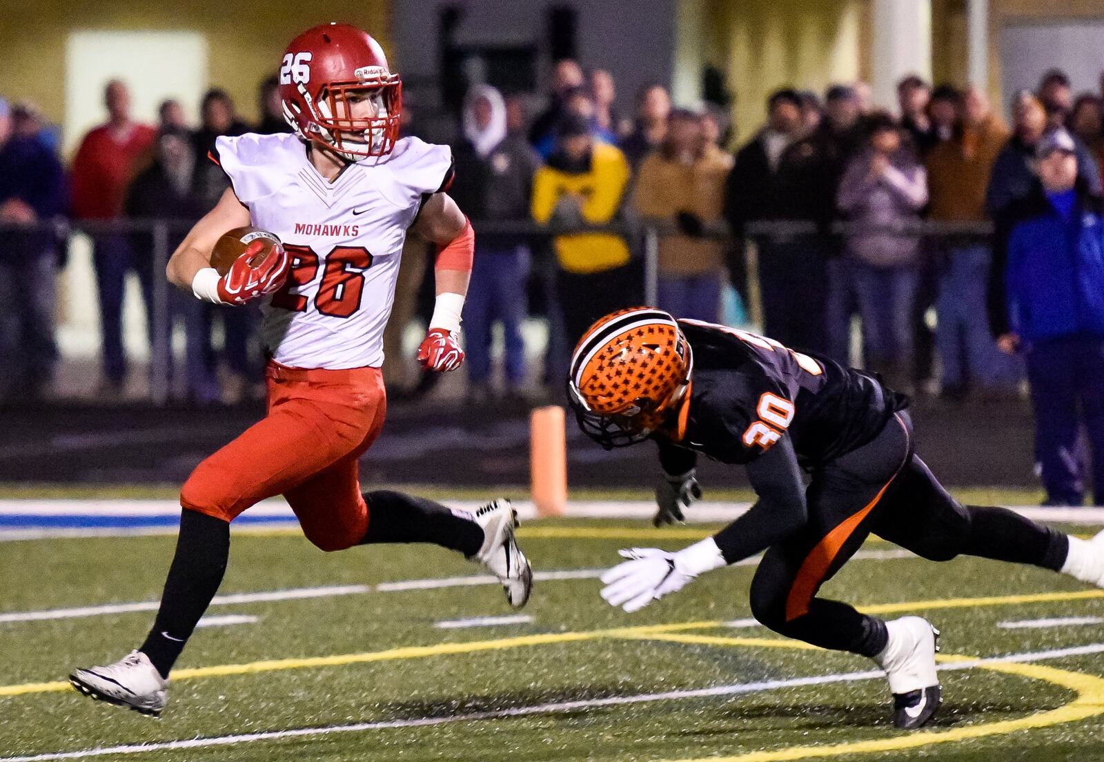 Madison’s Cameron Svarda breaks free from Wheelersburg’s Avery Donini during their Division V state semifinal Nov. 24 at Herrnstein Field in Chillicothe. NICK GRAHAM/STAFF
