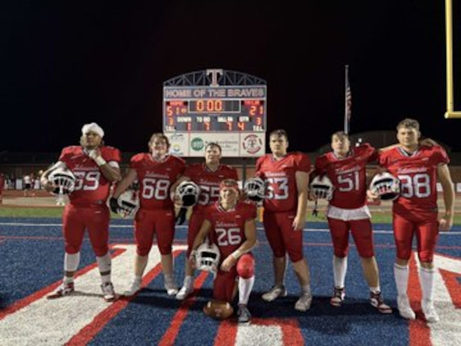 Talawanda's offensive line stand behind running back Lance Cantrell following Cantrell's big performance against Taylor on Friday night. CONTRIBUTED