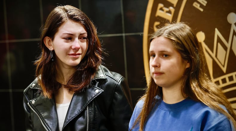 Aspen Schiebout (left) and Riley Blair (right) hold back tears as they talk about Grace Maxwell, a Junior at Cedarville University. Maxwell was one of over 60 people that died in a mid air collision earlier this week. MARSHALL GORBY \STAFF