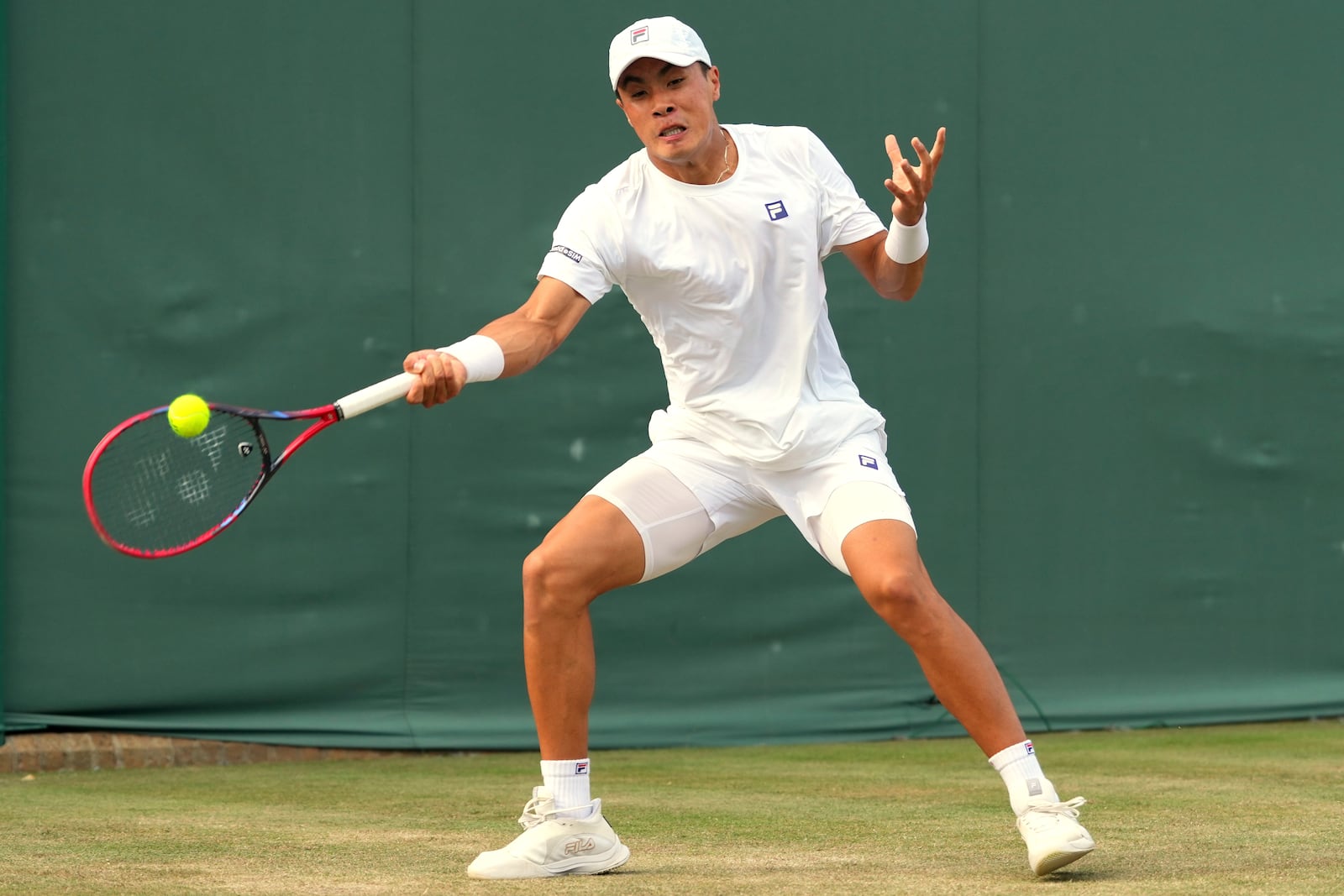 Brandon Nakashima of the U.S. returns to Reilly Opelka of the U.S. during their second round men's singles match at the Wimbledon Tennis Championships in London, Thursday, July 3, 2025.(AP Photo/Kirsty Wigglesworth)