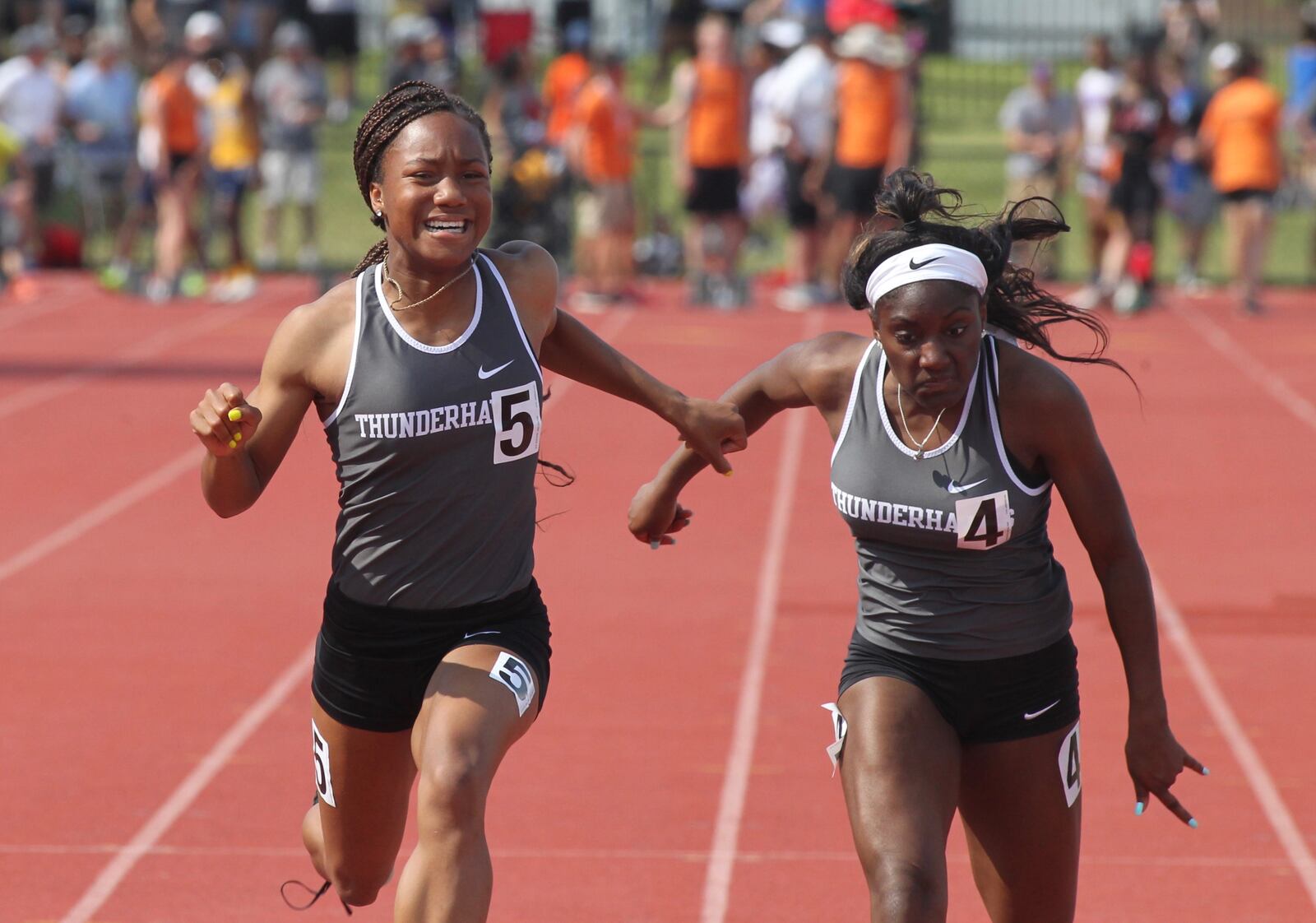 Lakota East's Kaylyn Heath, left, and Serena Clark finish first and second in the 100-meter dash on Saturday, June 1, 2019, at the Division I state track and field championships at Jesse Owens Memorial Stadium in Columbus.