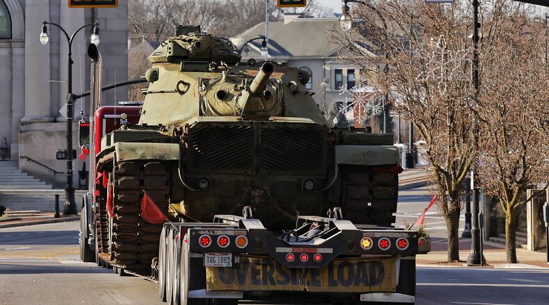 A military tank is carried on a trailer through downtown Hamilton Tuesday, Dec 14, 2021. NICK GRAHAM / STAFF