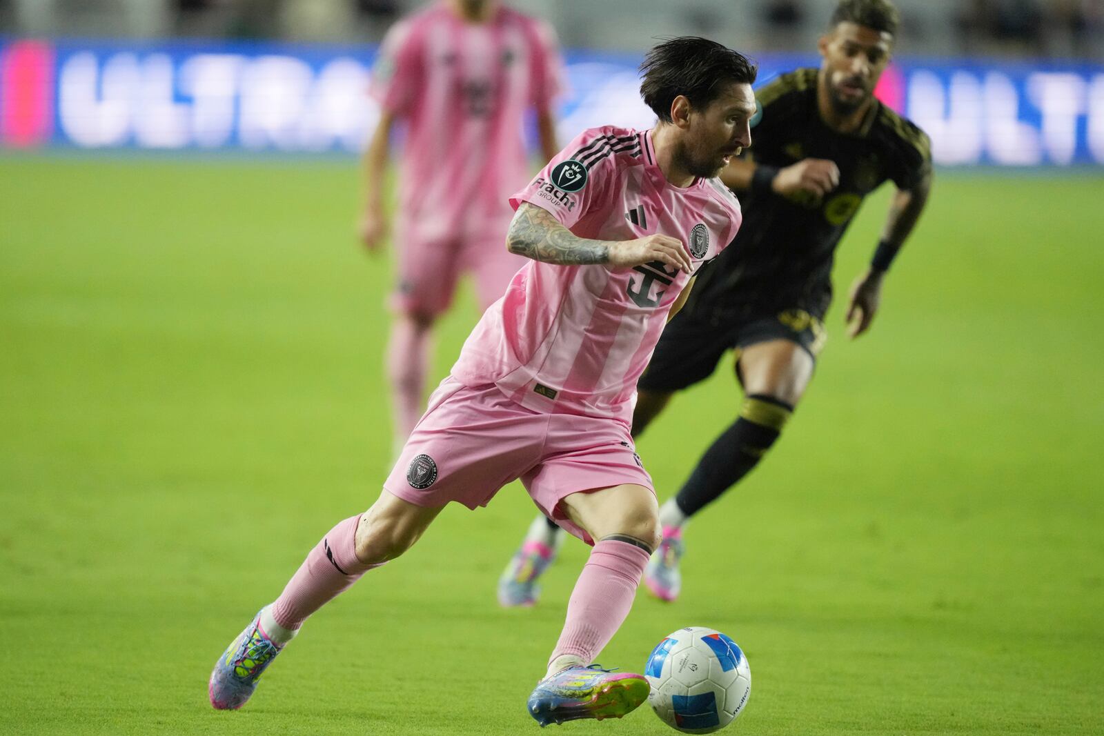 Inter Miami forward Lionel Messi (10) brings the ball up the field against the Los Angeles FC during the second half of a CONCACAF Nations League Quarterfinal Match at Chase Stadium, Wednesday, April 9, 2025 in Fort Lauderdale, Fla. (AP Photo/Jim Rassol)