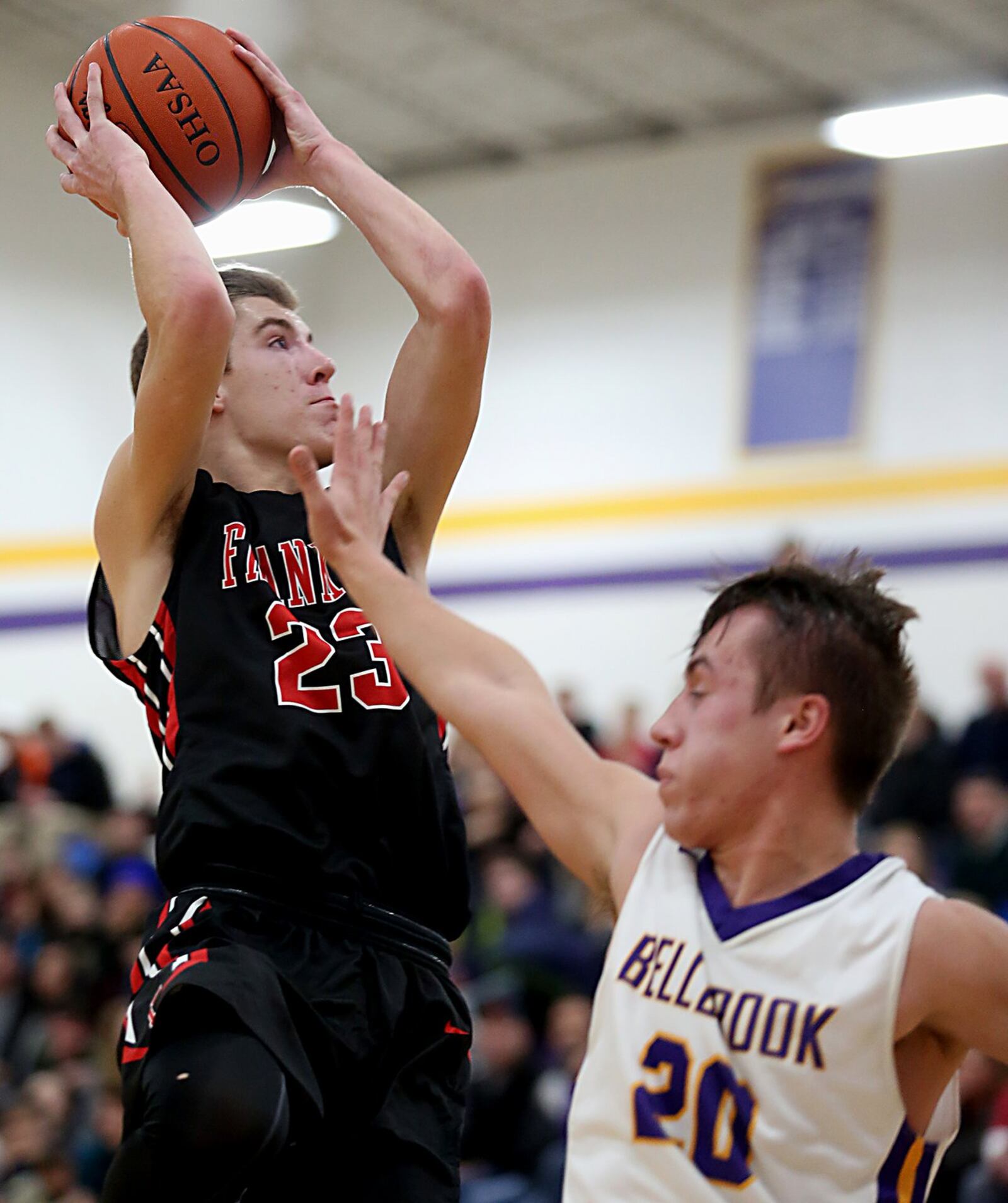 Franklin guard Jared Kinzer goes up and over Bellbrook guard Donnie Crouch during their game at Bellbrook on Friday night. CONTRIBUTED PHOTO BY E.L. HUBBARD